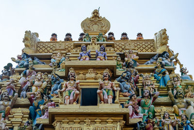 Low angle view of statues on temple building