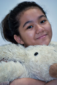 Close-up portrait of a smiling young woman