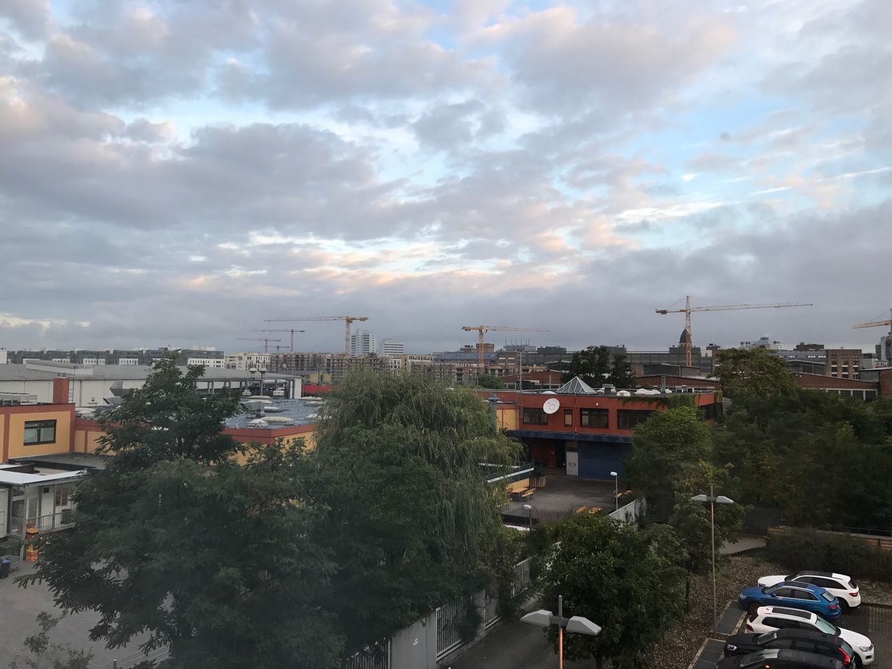 CITYSCAPE AGAINST CLOUDY SKY