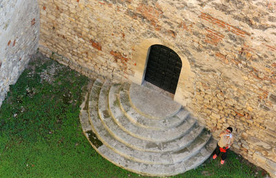 High angle view of man standing on the wall