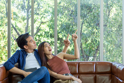 Young couple sitting on sofa