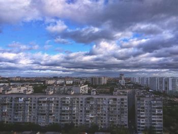 High angle view of buildings in city against sky