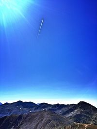 Scenic view of mountains against clear blue sky