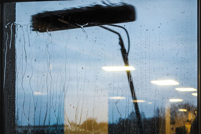 Raindrops on glass window during rainy season