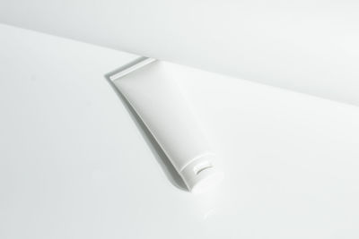 High angle view of electric lamp against white background
