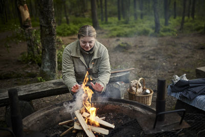 Man preparing food on fire