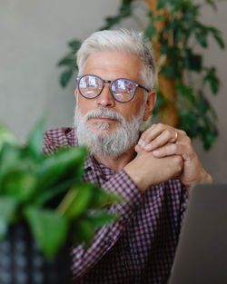 Businessman with eyeglasses looking away