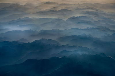Aerial view of mountains in fog