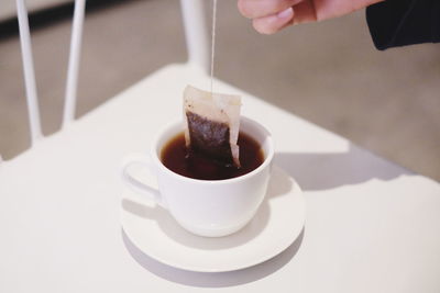 Close-up of coffee cup on table