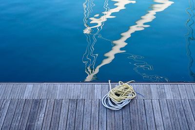 Nautical ropes on a wooden dock of the port