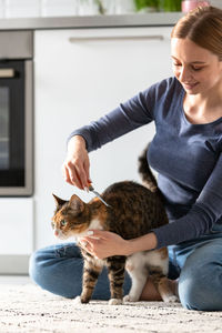 Portrait of man with cat