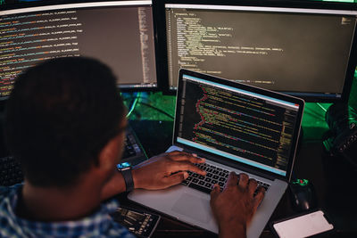 Close-up of computer programmer working at office