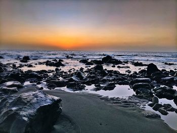 Scenic view of beach during sunset