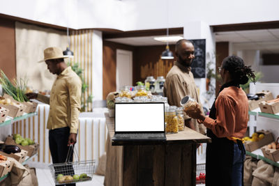 Side view of man working at office