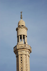 Low angle view of bell tower against sky