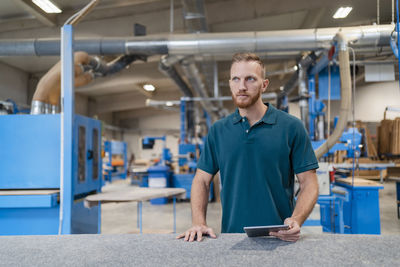 Portrait of man working in factory