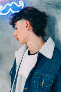 Fashion portrait of teenager wearing denim jacket