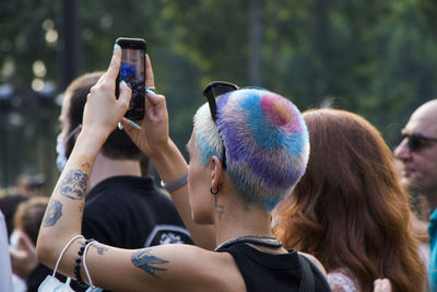 Rear view of people photographing