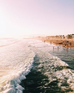 High angle view of waves at beach against clear sky