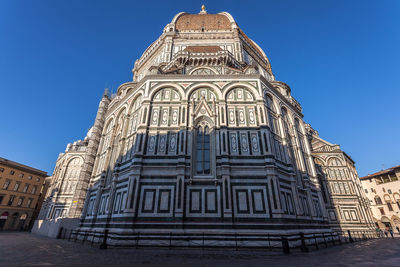 Low angle view of temple against clear blue sky