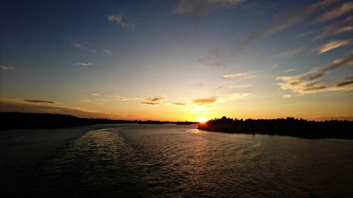 Scenic view of lake against sky during sunset