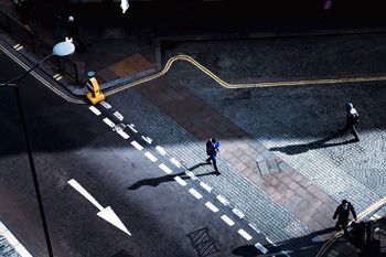 High angle view of people walking on city street