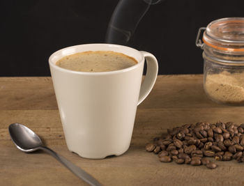 Close-up of coffee cup on table