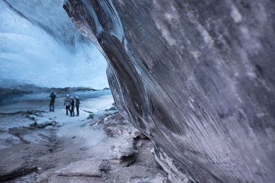 People on snow covered rock