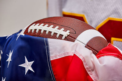 Close-up of flag against blue wall