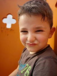 Portrait of smiling cute boy making a face