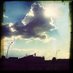Low angle view of building against cloudy sky