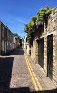 Street amidst buildings against sky