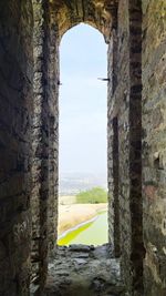 View of historic building seen through window