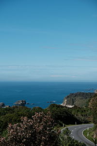 High angle view of road by sea against sky