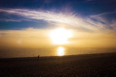 Scenic view of sea at sunset