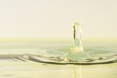 Close-up of drop splashing in water