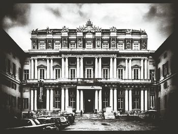 Low angle view of building against cloudy sky