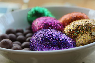 Close-up of dessert and easter eggs in bowl on table