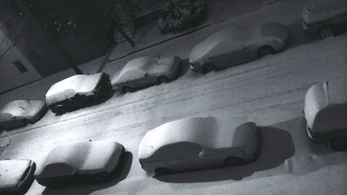 Cars on snow covered landscape