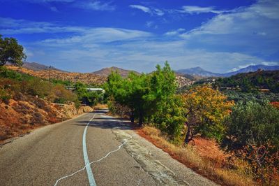 Empty road with mountain in background