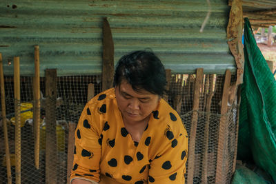 Portrait of woman sitting outdoors