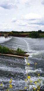 Scenic view of river against sky