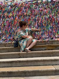 Low section of woman sitting on staircase