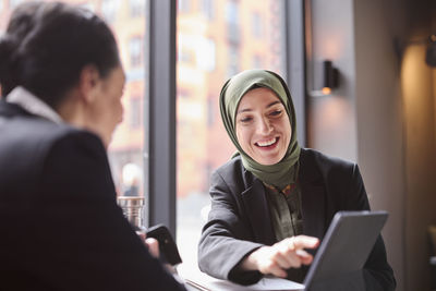 Two businesswomen sitting in cafe