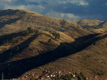 Scenic view of landscape against cloudy sky