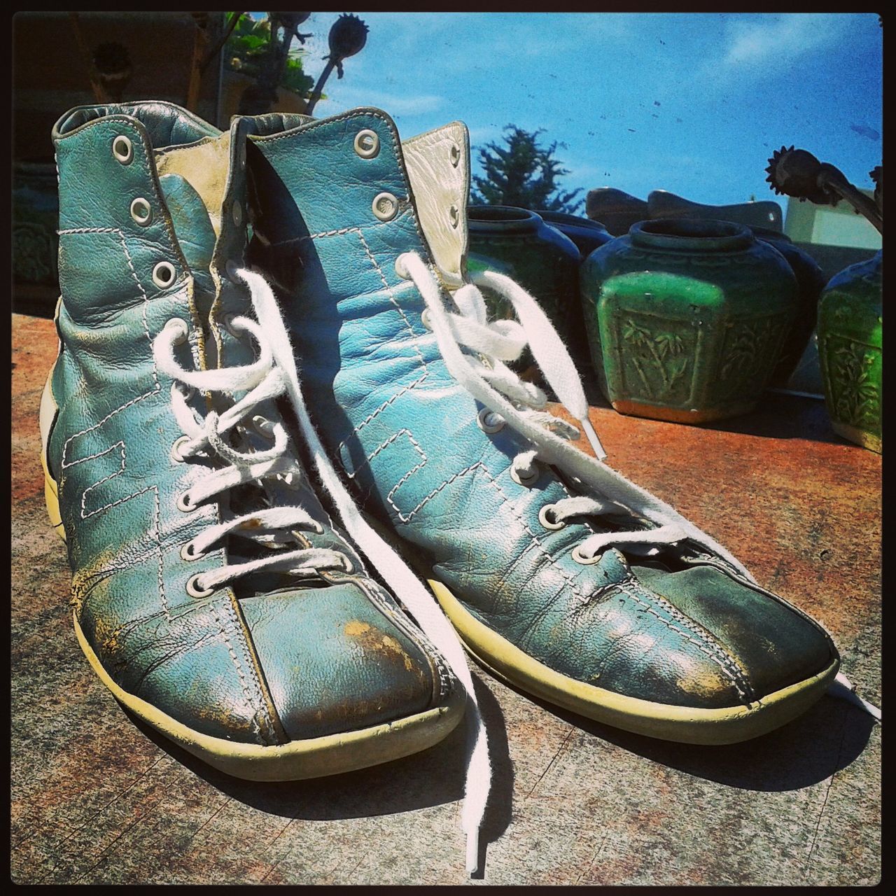 shoe, transfer print, auto post production filter, old, close-up, footwear, art and craft, abandoned, pair, blue, obsolete, damaged, human representation, outdoors, day, art, low section, creativity, old-fashioned, land vehicle