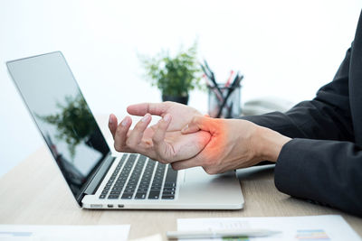 Man using laptop on table