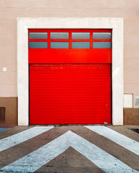 Close-up of red closed door of building