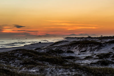 Scenic view of sea against sky during sunset