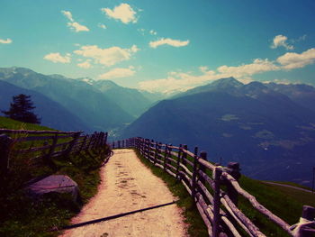 Scenic view of landscape against cloudy sky